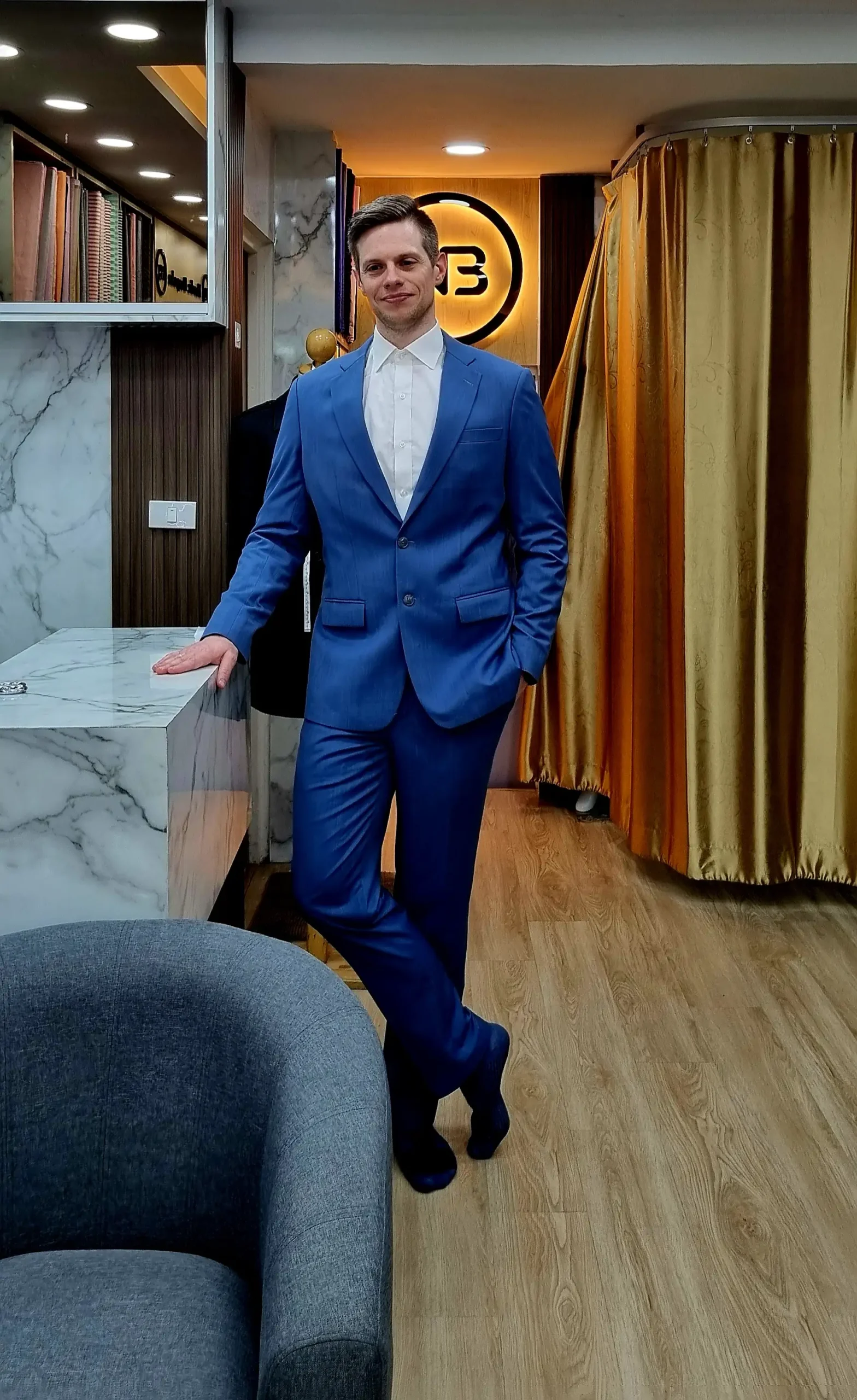Customer wearing a blue suit inside the showroom