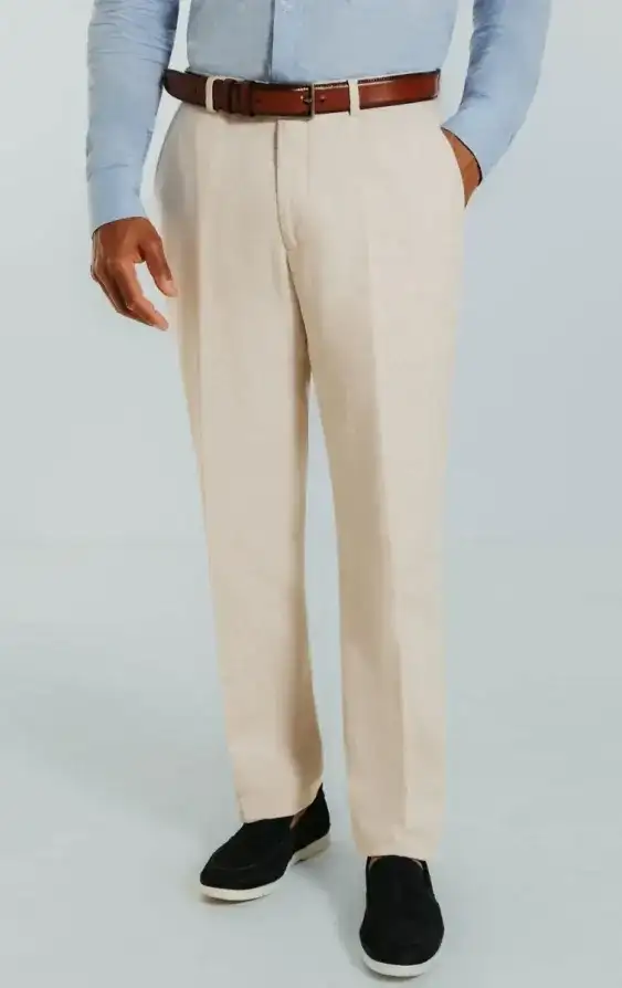 Close-up of beige tailored trousers with clean bespoke tailoring