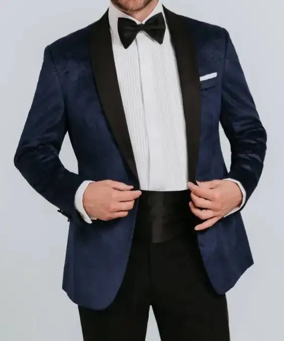 Navy tuxedo jacket with black lapels, white shirt and black bow tie