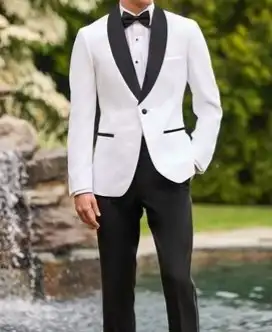 White tuxedo jacket with black lapels and black trousers