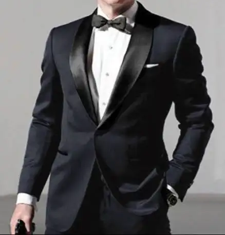 Dark tuxedo with contrasting glossy lapels and a black bow tie