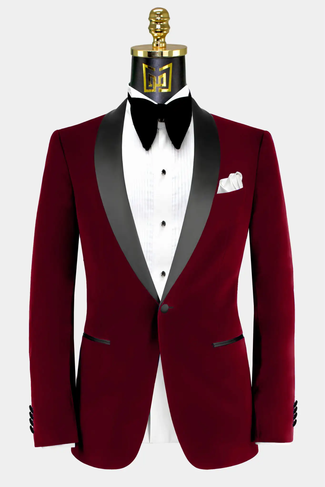 Burgundy tuxedo jacket with black lapels displayed on a mannequin
