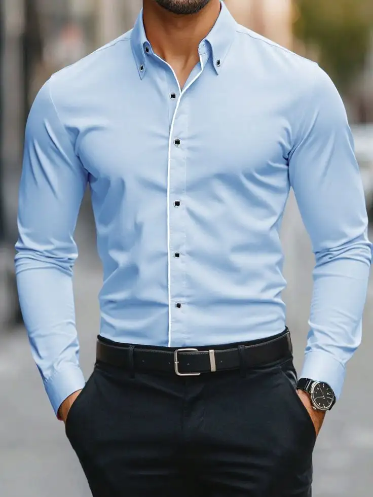 Man wearing a light blue shirt with black trousers and belt