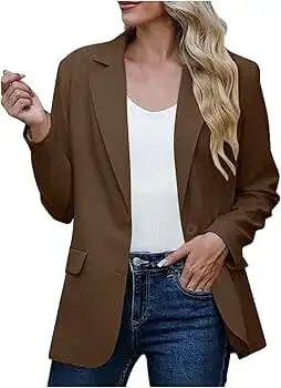 Woman wearing a brown blazer with a white top and blue jeans