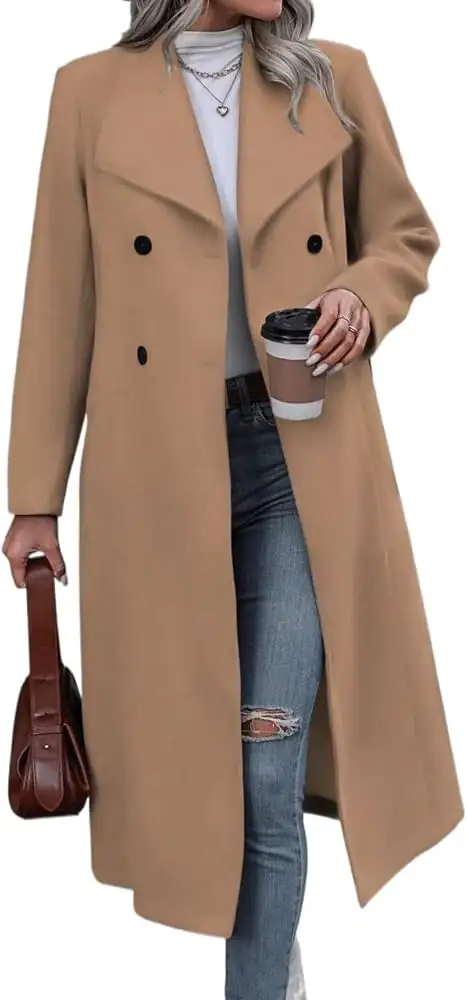 Woman wearing a tan double-breasted overcoat with blue jeans