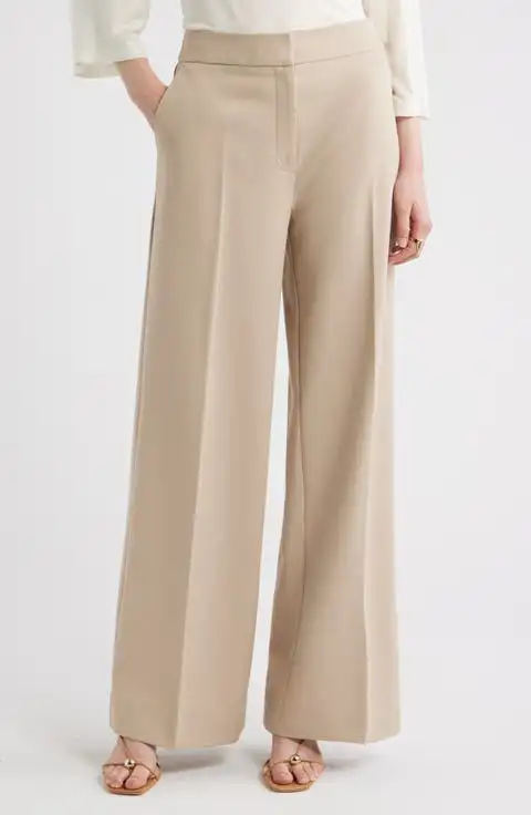 Beige wide-leg trousers worn with a white top